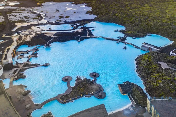 Hikers on the Fagradalsfjall lava before a Blue Lagoon stop on an Iceland volcano tour