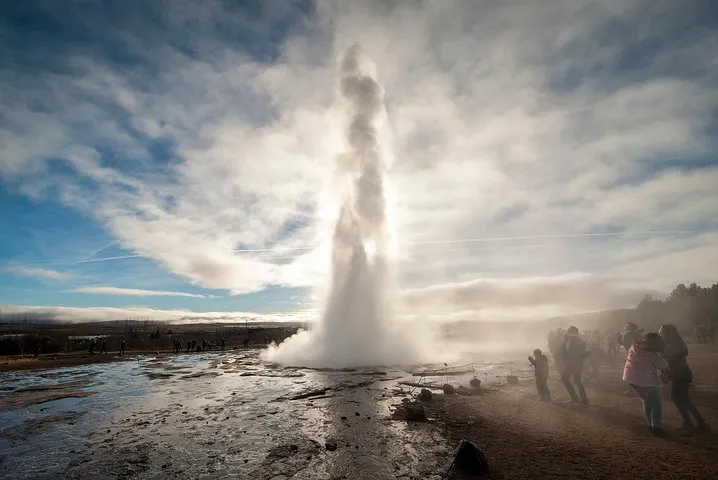 Steam over the Secret Lagoon on a Golden Circle and Kerid crater Iceland volcano tour
